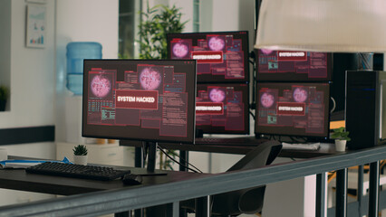 Empty agency office with computer showing system error security and hacking alert, critical error message flashing on screen. Multiple monitors with security breach threat and cyber crime attack.