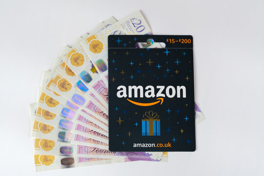 Amazon Gift Card close up image and cash. Stafford, United Kingdom, January 24, 2023