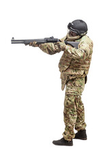 military commando in uniform with a shotgun attacks and aims on a white background, soldier in action