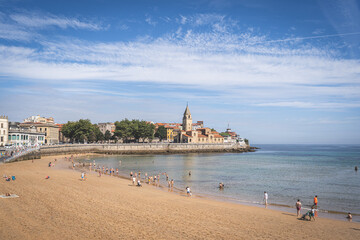 Summer day in San Lorenzo beach in the city of Gijon, Spain
