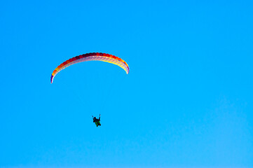 paraglider against the blue sky