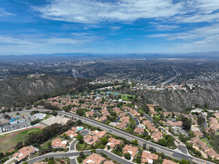 Aerial view over La Jolla Hills with big villas and ocean in the background, San Diego, California, USA