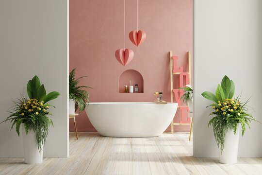 Valentine's day in bathroom with bathtub on empty red wall.