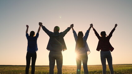 Teamwork of people raising their hands to sky, family business team concept. Group of people...