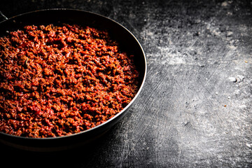 Delicious bolognese sauce in a frying pan. 