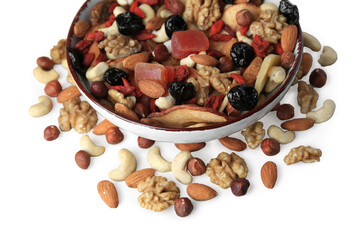 Bowl with mixed dried fruits and nuts on white background