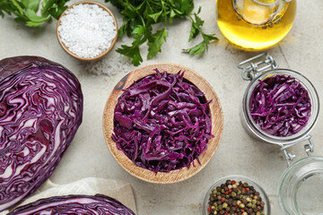 Tasty red cabbage sauerkraut and different ingredients on table, flat lay