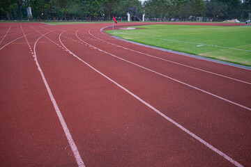 Empty fast running lane in outdoor sport stadium