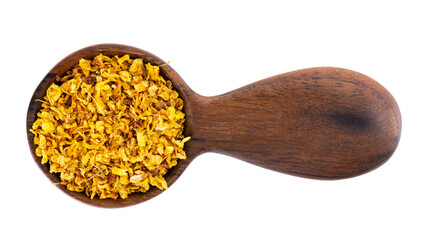 Osmanthus tea in wooden spoon, isolated on white background. Dry flowers of Osmanthus fragrans. Top view.