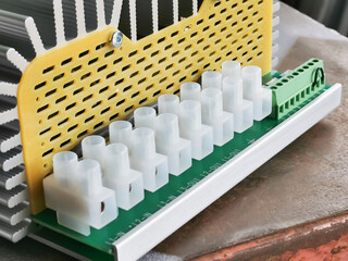 Selective focus image of electric heating controller in electrical panel.