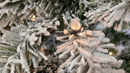 Close up of fake pre-lite snow covered Christmas tree