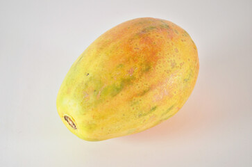 whole and half of ripe papaya fruit with seeds isolated