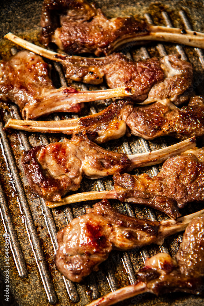 Canvas Prints A rack of lamb in a grill pan. 