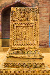 Thatta, Sindh, Pakistan - October 2021: Beautiful traditional intricate geometric and floral carved stone detail, decoration, in a royal mausoleum in Makli necropolis