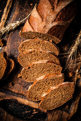 Slices of fragrant bread on a wooden cutting board.