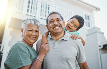 Obraz premium Portrait, piggyback and happy grandparents with a child in the backyard of their family home. Happiness, smile and elderly man and woman in retirement bonding with their grandson outdoor their house.