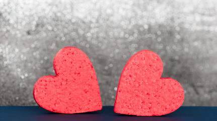 Obraz premium Valentines day background, two red hearts with copy space, selective focus