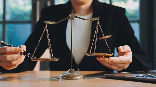 Business and lawyers discussing contract papers with brass scale on desk in office. Law, legal services, advice, justice and law concept picture with film grain effect