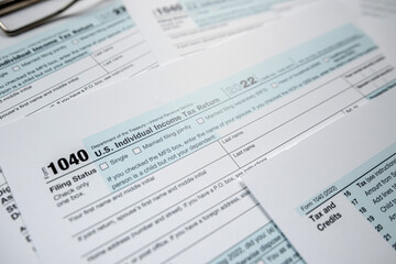 Blank 1040  individual income tax return on desk