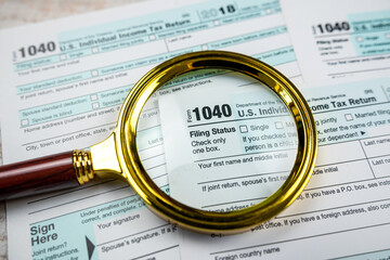 blank of individual tax form with magnifying glasses