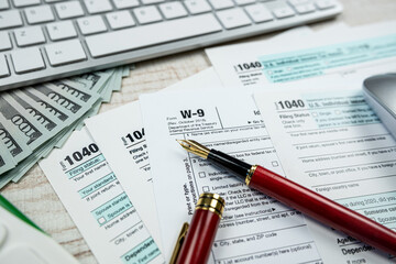 2022 blank tax form 1040 with us dollar biils
