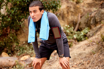 Mountain, exercise and man tired, workout and running outdoor, sweaty and exhausted with fitness...