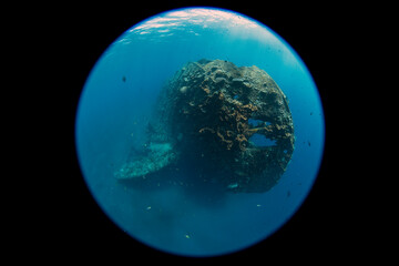 Wide angle underwater photography with a special circular fisheye lens. The famous Liberty ship wreck at Tulamben, Bali, Indonesia.