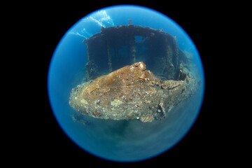 Wide angle underwater photography with a special circular fisheye lens. The famous Liberty ship wreck at Tulamben, Bali, Indonesia.