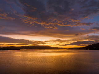 After the rain sunrise waterscape with clouds