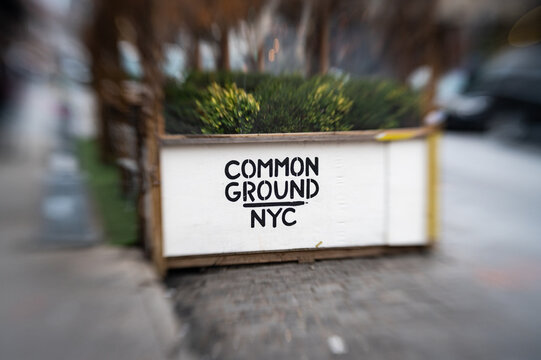 Photo of the sign for the Common Ground Bar and outside eating area on Gansevoort Street, in the Meatpacking District.