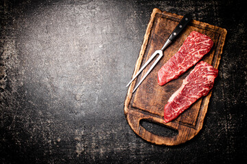 Raw steak on a cutting board. 