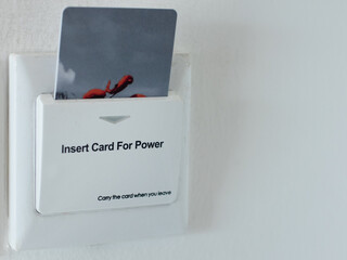 an electric switch that uses a card to activate electrical power, is commonly used in hotels and...
