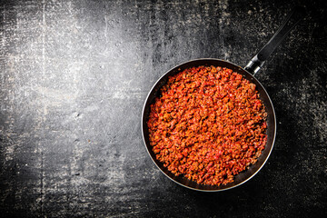 Delicious bolognese sauce in a frying pan. 