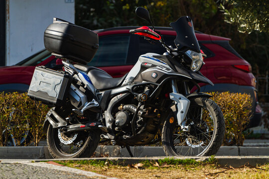 Side, Turkey -January 22, 2023:    A  black motorcycle Viar Vortex   stands in a parking against the backdrop of street