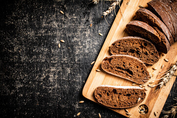 Sliced rye bread on a cutting board. 