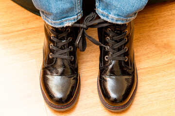 April fools day concept.A shoe tied together at home in the living room.