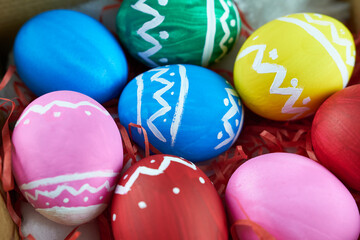Fototapeta na wymiar Colorful background of Easter eggs. Colorful eggs in close-up. Happy Easter.