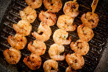 Grilled shrimp in a frying pan. 