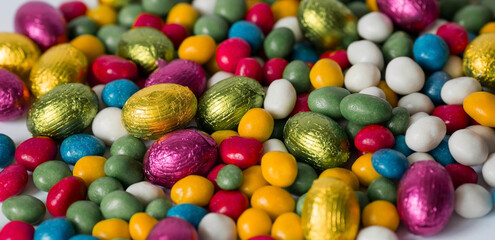 Fototapeta na wymiar A beautiful postcard. Banner. The concept of a bright Easter holiday. Chocolate Easter eggs on a white isolated background. Sweets and sweets.