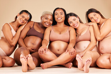 Pregnant woman group, studio portrait and support for happiness, diversity or smile for solidarity by background. Friends, pregnancy and happy with excited face, future or sitting for hug by backdrop