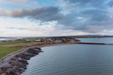 Fototapeta premium Aerial panorama view of the Samphire Island in Tralee Bay, dramatic sky, beautiful clouds, sunset. High quality photo