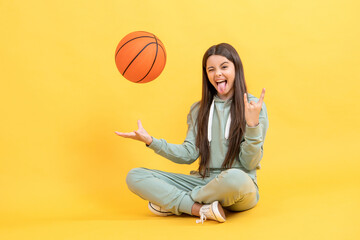 cool teen basketball girl in studio. teen basketball girl on background.