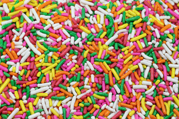Fototapeta na wymiar colorful sugar sprinkles, decoration for cake and bakery as background