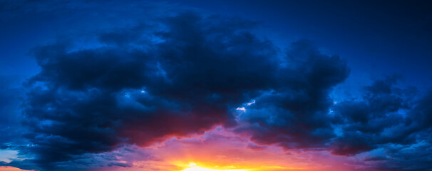 Clouds at sunset. Blue and orange. A wonderful natural background.