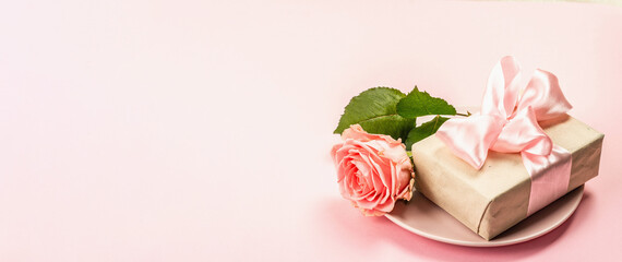 Fototapeta na wymiar Romantic dinner table isolated on rose background. Love concept for Valentine's or Mother's day