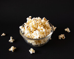 Butterfly Popcorn in glass from a top angle with a dark background.
