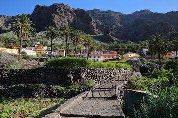 Mountainous and green landscape with terraced fields and palm trees in Chele, Valle Gran Rey, La...