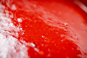 Sauce of ripe tomatoes. Macro background.