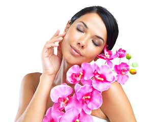 A beautiful woman holding a flower against her body isolated on a PNG background.