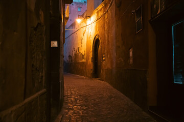 Procida street with night lights.
